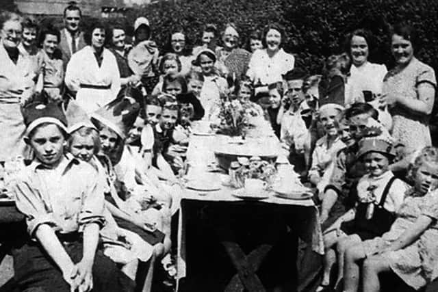 Douglas Roberts (right in braces), Maurice behind him. Girl in large hat is Christine with Laura Jane behind her. Douglas’s father back left along with his mother. Picture: Douglas Roberts.