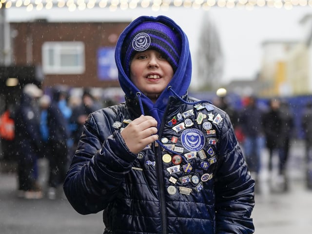Braving the elements before kick-off.