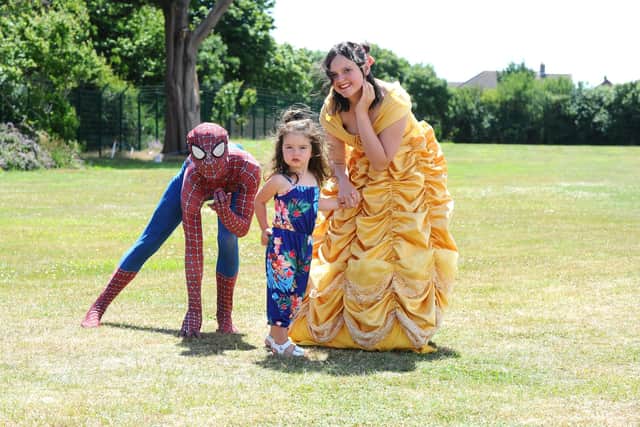 Isla Powell (2) from Southsea, with Spiderman and Belle from Sparkle Entertainment Hampshire.
Picture: Sarah Standing (280622-7309)