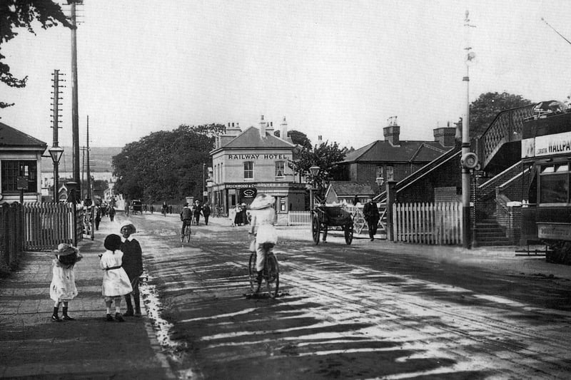 The level crossing High Street, Cosham, with the Railway Hotel and the footbridge over the tracks which hasn't changed to this day. Picture: Costen.co.uk