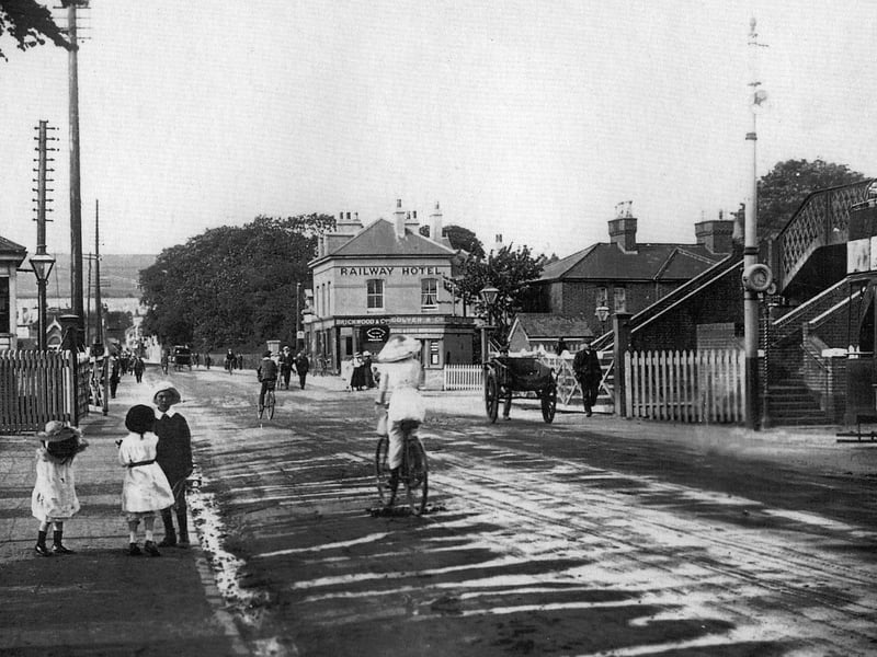 The level crossing High Street, Cosham, with the Railway Hotel and the footbridge over the tracks which hasn't changed to this day. Picture: Costen.co.uk