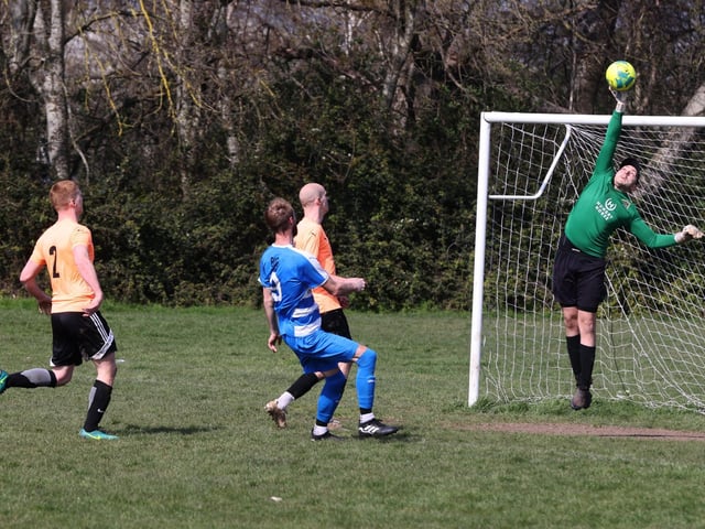Action from the Buster Gordon Memorial Cup tie between AC Copnor (blue and white kit) and Seagull (orange and black kit). Picture: Sam Stephenson