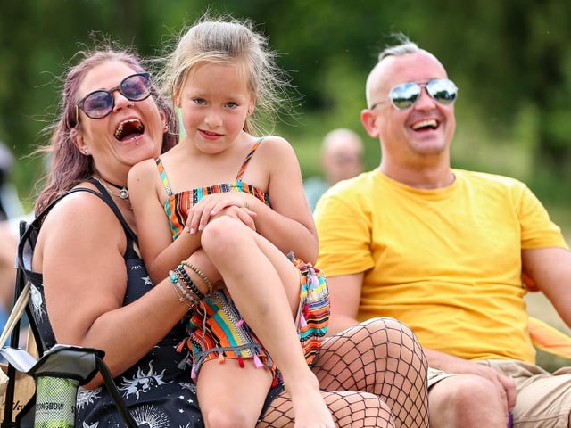 Fern-Hope, 7, with her mother. Live at the Bandstand, King George V playing fields, Cosham. Picture: Chris Moorhouse (130724-39)