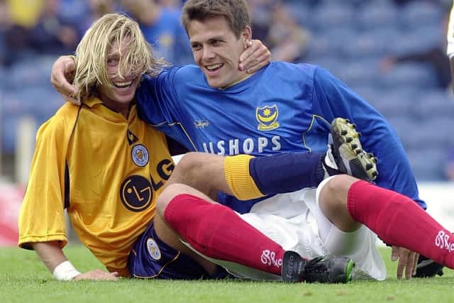 Robbie Savage and Stefani Miglioranzi share a smile in Pompey's match with Leicester City. Picture: Steve Reid