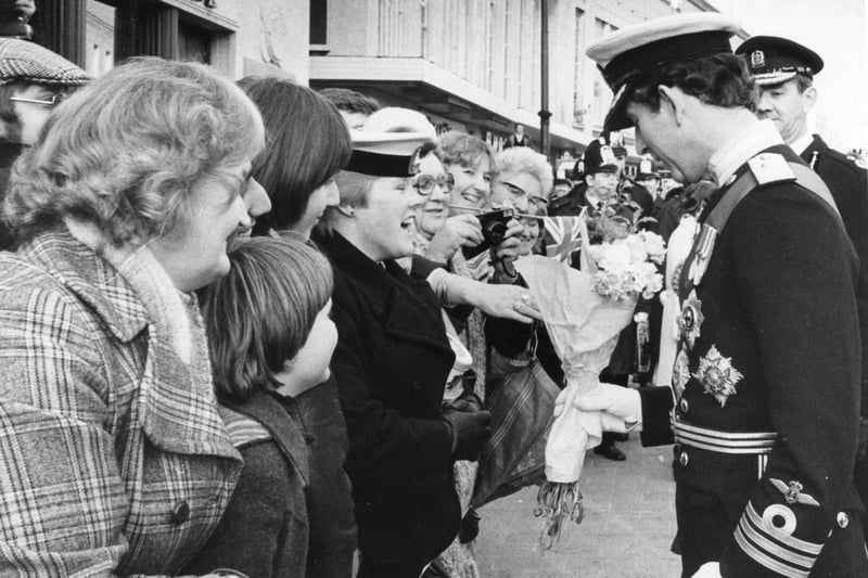 Prince Charles accepts a bouquet of flowers in 1979 before the Freedom of the City ceremony