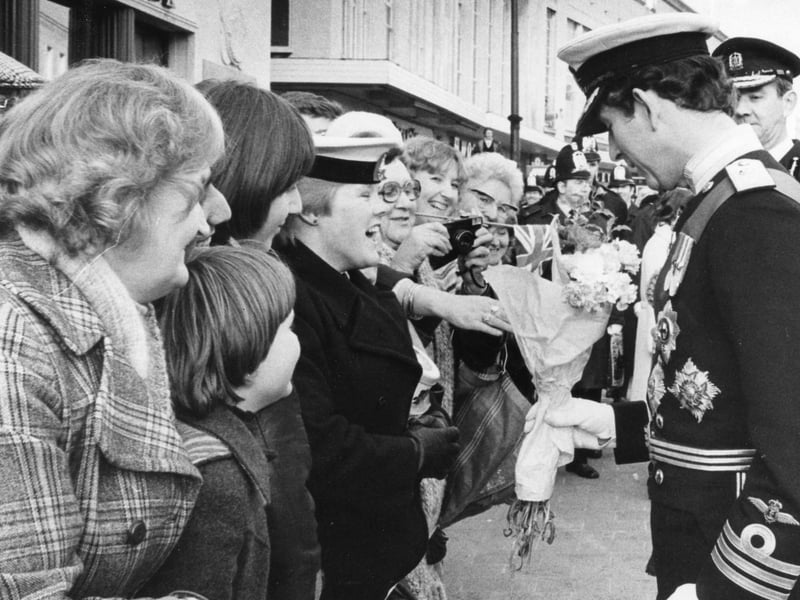 Prince Charles accepts a bouquet of flowers in 1979 before the Freedom of the City ceremony