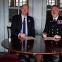 Neil Hayward, Chair of Hampshire and Isle of Wight Healthcare NHS Foundation Trust with Lieutenant Commander Steve Cass RN, Commanding Officer of HMS Victory, signing the Armed Forces Covenant aboard the HMS Victory in Portsmouth.