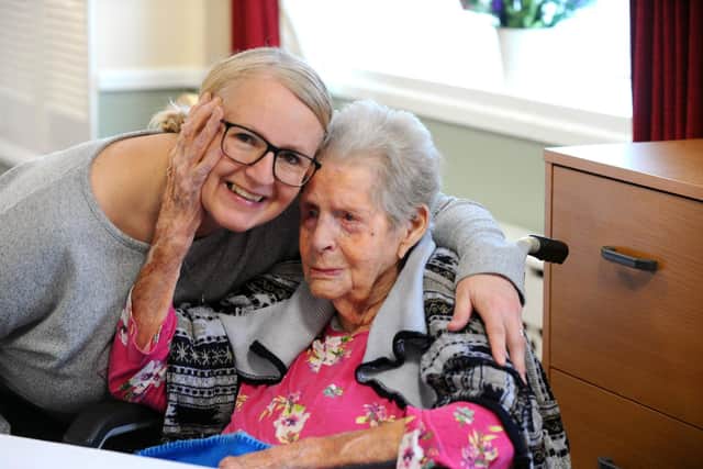 Dorothy Aslett celebrated her 104th birthday on February 3, 2023, at Cosham Court Nursing Home.Pictured is: Dorothy Aslett with her granddaughter Sam Lloyd from Warsash.Picture: Sarah Standing (230223-5668) 