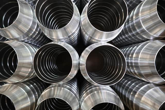 CAPTION: Parts made by Portsmouth firm Excell Metal Spinning for use in public health spraying