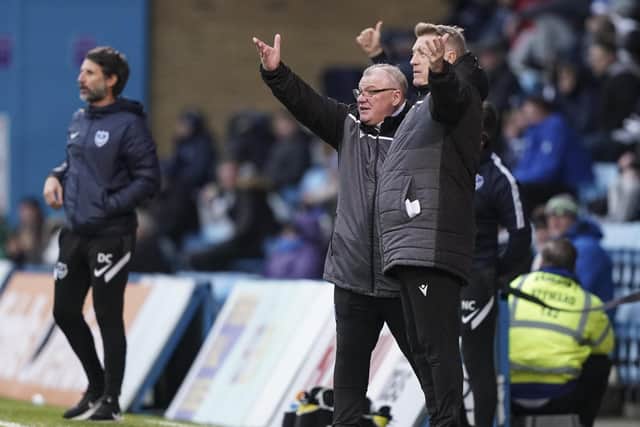 Gillingham boss Steve Evans and assistant Paul Raynor gesture to the referee on Saturday.