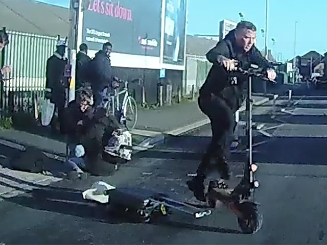 Dashcam shows Joseph Pedelty having run a red light and crashing into Raquel Delgado-Calo before getting back onto the scooter and leaving the scene.