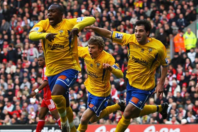 Richard Pacquette celebrates heading Hawks into the lead at Anfield in the FA Cup fourth round in January 2008. Photo by Mark Thompson/Getty Images.