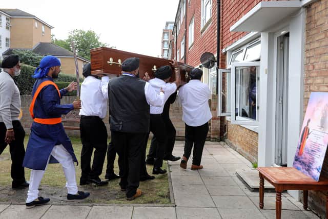 The coffin is borne into the house
Picture: Chris Moorhouse (jpns 280721-17)