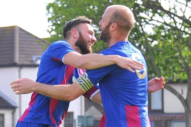 Tom Jeffes, right, is congratulated after scoring US Portsmouth's winning penalty against Bemerton in the Wessex League Cup semi-final shoot-out. Picture: Victory Stadium.