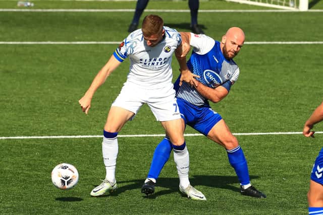 Former Gosport skipper Mike Carter, right, in FA Cup action for AFC Totton against Hawks this season. Picture by Dave Haines