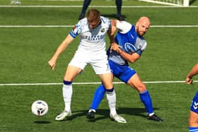 Former Gosport skipper Mike Carter, right, in FA Cup action for AFC Totton against Hawks this season. Picture by Dave Haines