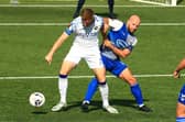 Former Gosport skipper Mike Carter, right, in FA Cup action for AFC Totton against Hawks this season. Picture by Dave Haines