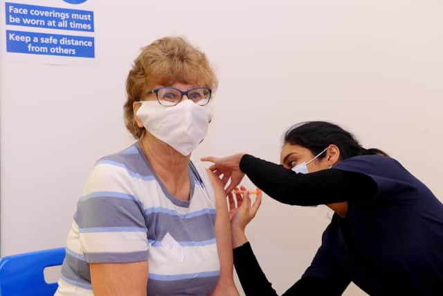 Jen Hedges, 74, from Clanfield, getting her Covid jab at the Greywell Pharmacy Covid-19 Vaccination Centre. Picture: Sarah Standing (040221-2270)