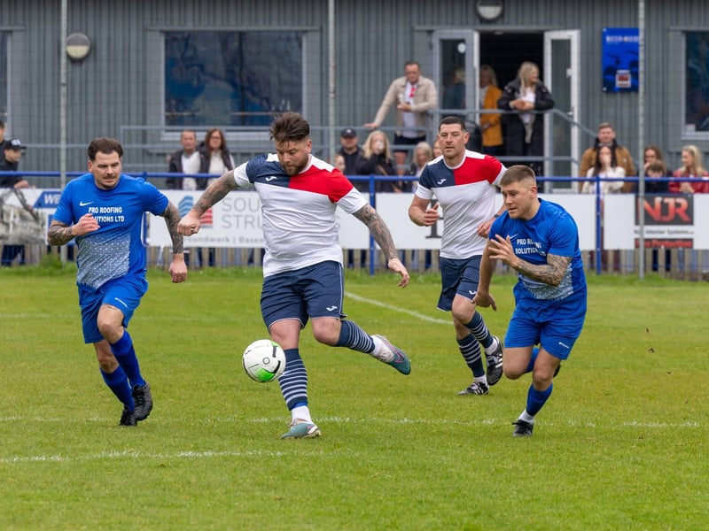 A Team Sherie player races away from two Portsea players.