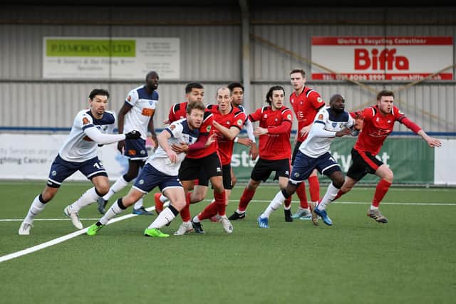Hawks and Eastbourne Borough players attack a corner. Picture: Neil Marshall