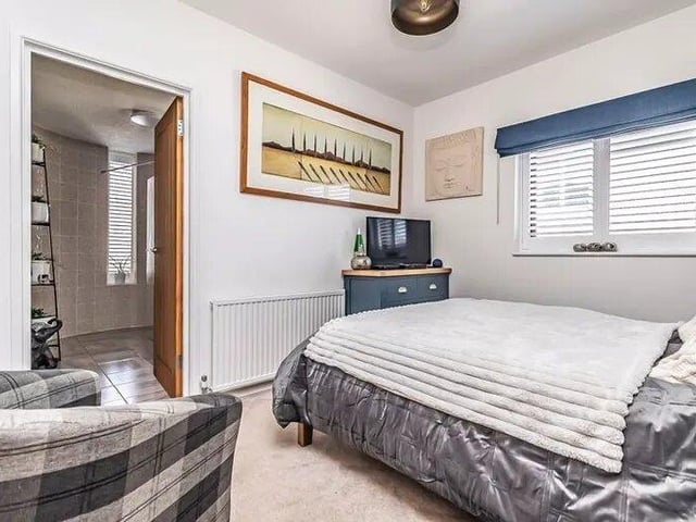 The listing says: "17 Castle Road is a truly captivating two-bedroom townhouse nestled in the heart of central Southsea. This remarkable property boasts a unique design, spread over three inviting floors, each exuding charm and character."