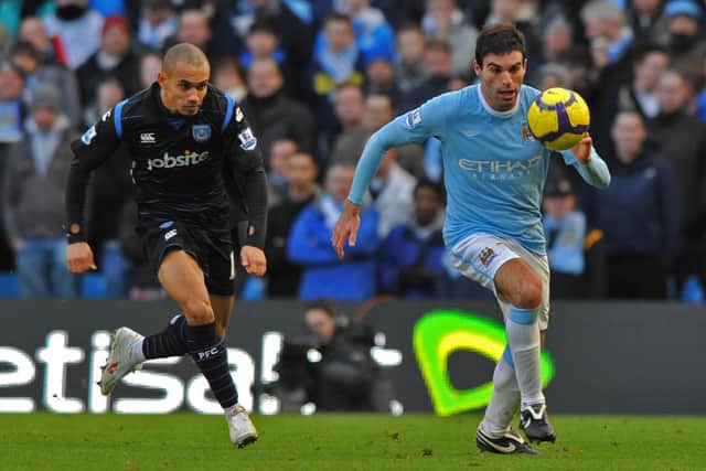 Danny Webber pursues Carlos Tevez in a match at Manchester City which had been earmarked for Pompey player protests during the game. Picture: Steve Reid