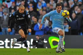 Danny Webber pursues Carlos Tevez in a match at Manchester City which had been earmarked for Pompey player protests during the game. Picture: Steve Reid