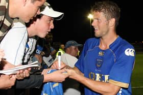 Hermann Hreidarsson after the pre-season friendly against the Hawks in 2008 signing autographs