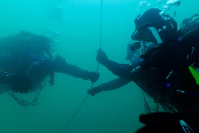 Divers in Ross Kemp: Deep Sea Treasure Hunter.
Photo: PA Photo/Sky HISTORY