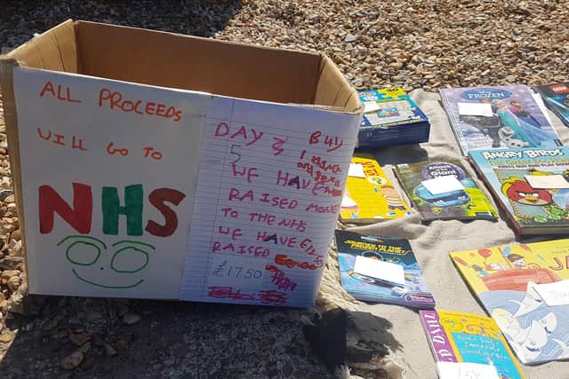Jacob Lee, 9 from Purbrook, has set up his own pop-up shop on his driveway to sell his old books and raise money for the NHS