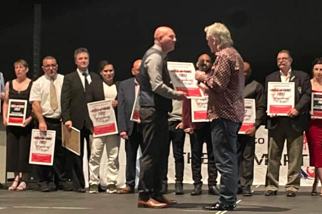 Daren Stirrat, left, receives his UK Martial Arts hall of fame inductee certificate from former Shokotan Karate world champion Bob Sykes