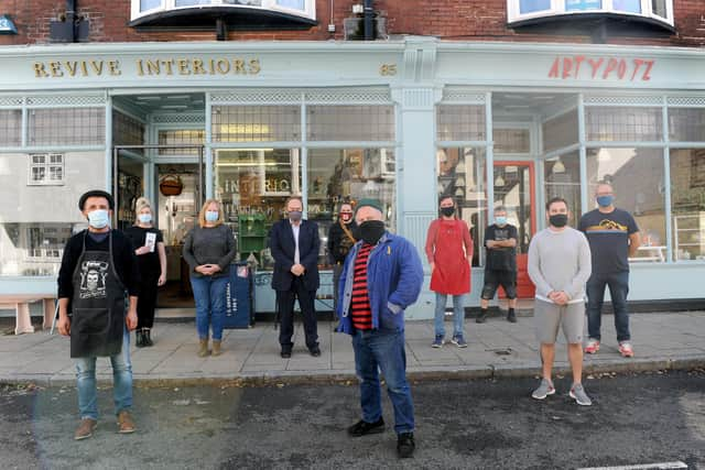 A section of Castle Road in Southsea, has been pedestrianised to allow for social distancing. Many traders are happy with the atmosphere this has created and believe it is a safer, better shopping experience for customers as a result.

Pictured is: (front middle) Pete Codling with Castle Road traders.

Picture: Sarah Standing (011020-4729)