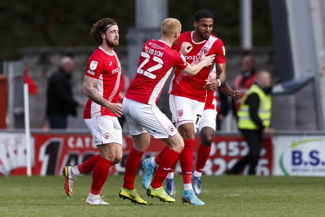 Jonah Ayunga celebrates his controversial leveller at Morecambe. (Photo by Daniel Chesterton/phcimages.com)