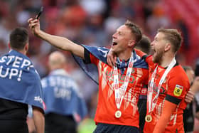 Luke Berry and Alfie Dougherty celebrate Luton's promotion to the Premier League. Picture: Alex Pantling/Getty Images