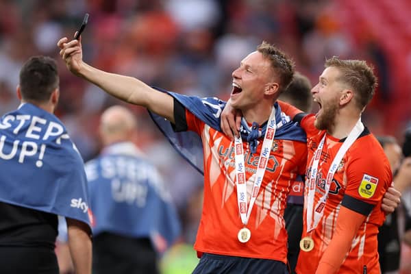 Luke Berry and Alfie Dougherty celebrate Luton's promotion to the Premier League. Picture: Alex Pantling/Getty Images