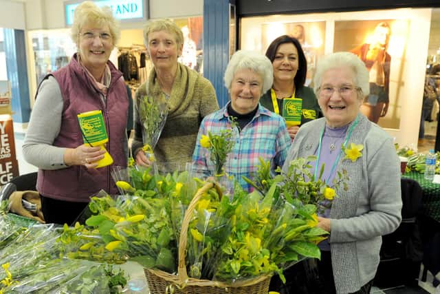 Fareham Flower Club sell Mother's Day posies at Fareham Shopping Centre during a previous event to raise money for the Hampshire Air Ambulance. Pictured left to right: Christine Watts, Pauline Warren-Smith, Christine Hillam , Jill Eastman - volunteer fundraiser for the Hampshire Air Ambulance and Margaret Henderson

Picture: Paul Jacobs (150442-1)