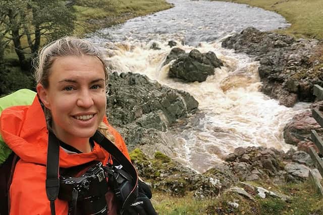 Emily Hayes getting to know her paper map in Scotland.