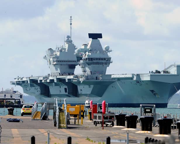 Britain's biggest warship HMS Queen Elizabeth pictured returning to Portsmouth after 10 weeks at sea, carrying out critical training.

Picture: Sarah Standing (020720-5149)