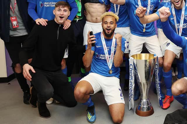 Matt Casey, left, celebrates Pompey's Checkatrade Trophy triumph with Anton Walkes. Picture: Joe Pepler