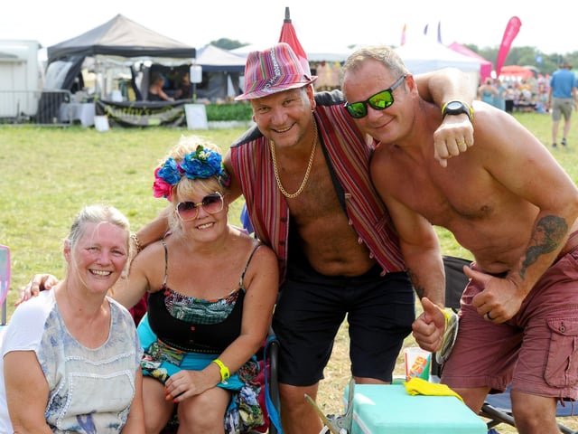 Wickham Festival 2024 got underway at their new arena site in Shedfield on Thursday, August 1. Pictured is: (l-r) Angie Barry from Portchester, Jasmine Malzard and Dave Malzard from Southsea with Paul Barry from Portchester, celebrating his 50th birthday.Picture: Sarah Standing (010824-2932)