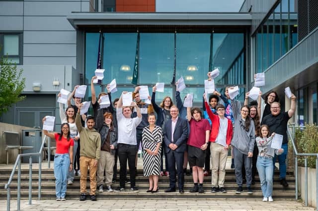 Andrew Kaye, CEO of South Hampshire College Group, and Ashley Martin, Director of student experience and transition at the group celebrate successful Level 3 and T Level results with students at Fareham College