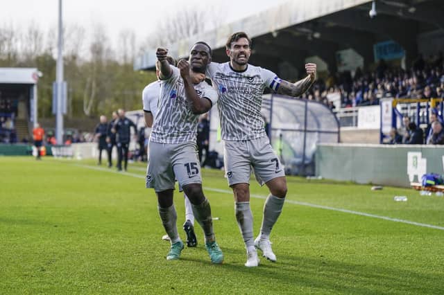Pompey goalscorer Christian Saydee celebrates with Marlon Pack in the 3-1 win at Wycombe. Picture: Jason Brown/ProSportsImages