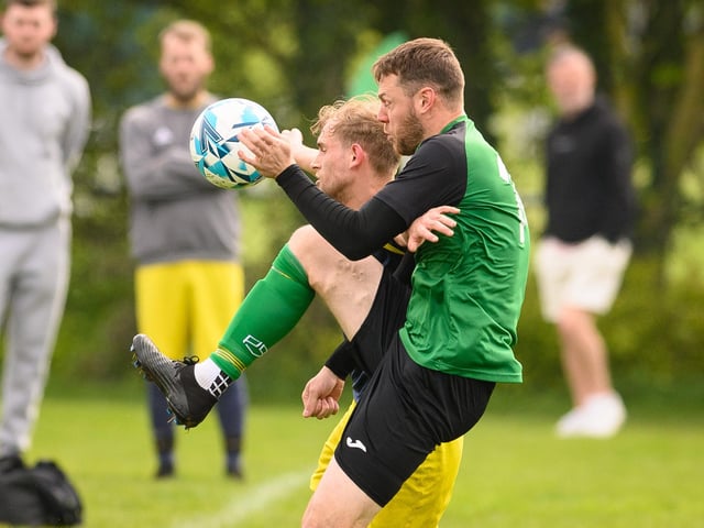 Action from Saturn Royale's 1-0 win over Pelham Arms (blue and yellow kit) in the second Adelaide Cup semi-final. Picture: Keith Woodland (300421-70)
