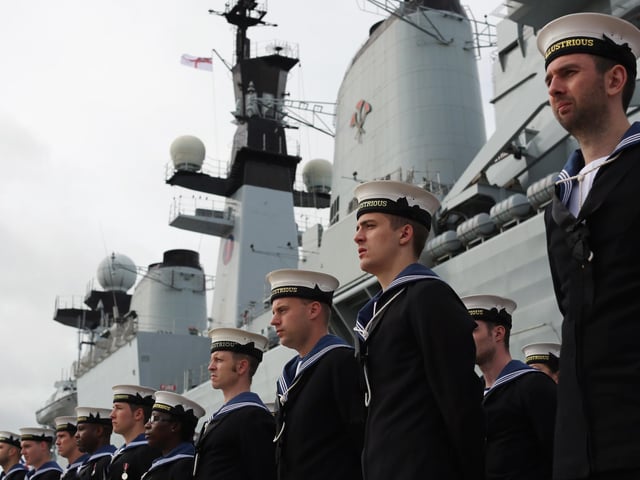 Company of the HMS Illustrious stand in formation during her decommissioning ceremony on August 28, 2014 in Portsmouth. Photo by Dan Kitwood/Getty Images