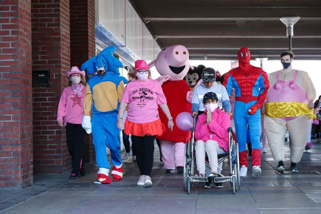 Staff at Tesco, Crasswell St, Portsmouth, on a fundraising walk around the boundary of the store.
Picture: Chris Moorhouse (jpns 240421-06)