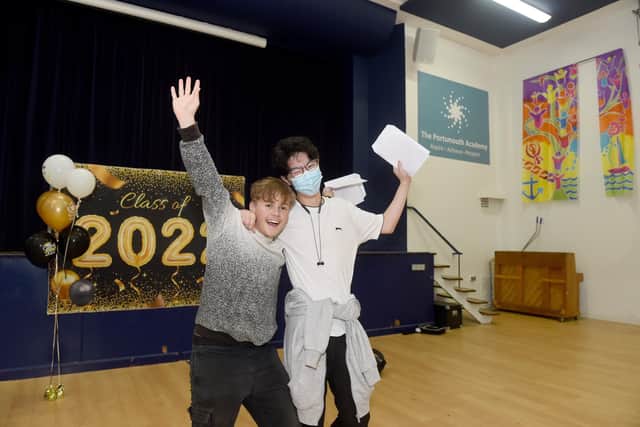 Pupils picked up their GCSE results at Portsmouth Academy in Portsmouth, on Thursday, August 25, 2022.

Pictured is: (l-r) Kaiden Collins (16) who got two 7s, three 6s, two 8s, one 4 and one 5 with Siang Gao (16) who got one 6, one 5, three 8s, and one 9, both from Portsmouth. 

Picture: Sarah Standing (250822-2116)