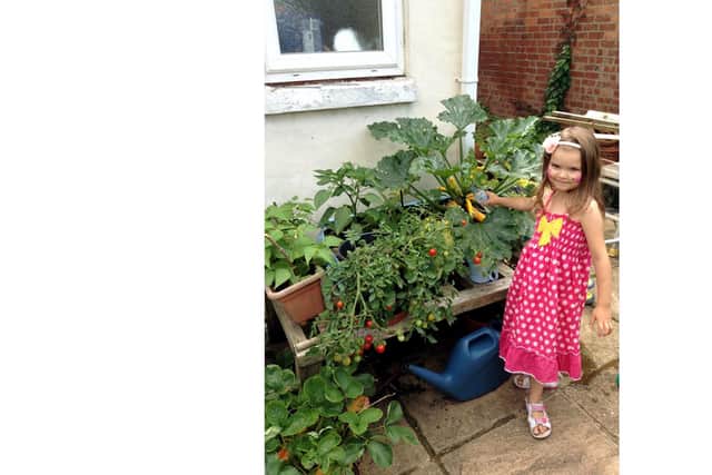 Goff's grandaughter Bethany helping out. Picture Goff Gleadle