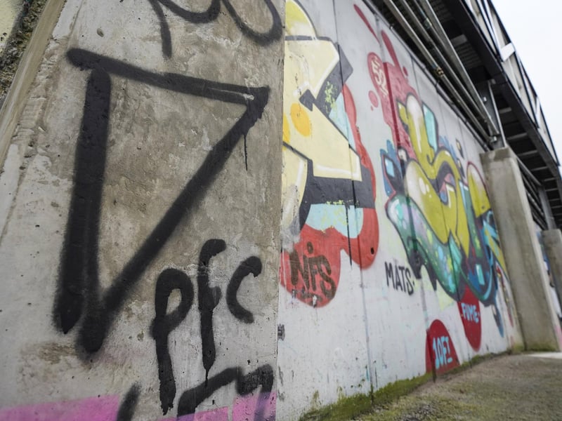 The £12m renovation project is almost complete - yet one part of Fratton Park remains out of bounds for ground improvements. Namely the iconic Specks Lane street art.