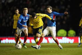 Ross McCrorie  and Ryan Williams challenge Gabriel Martinelli against Arsenal. Picture: Joe Pepler