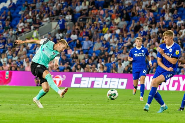 Joe Pigott fires Pompey ahead at Cardiff in Tuesday's League Cup win in south Wales.